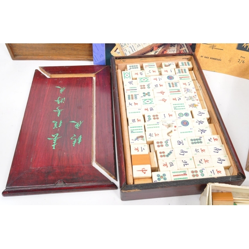 295 - Two 20th Century mahjong game sets each held within wooden boxes. Together with seven vintage wooden... 