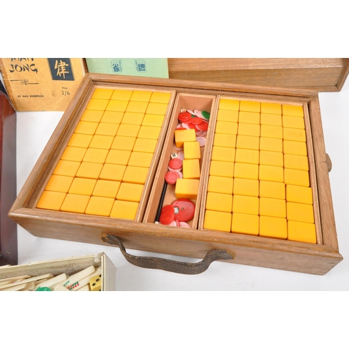 295 - Two 20th Century mahjong game sets each held within wooden boxes. Together with seven vintage wooden... 