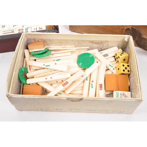 295 - Two 20th Century mahjong game sets each held within wooden boxes. Together with seven vintage wooden... 