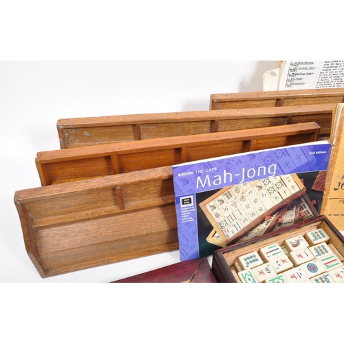 295 - Two 20th Century mahjong game sets each held within wooden boxes. Together with seven vintage wooden... 