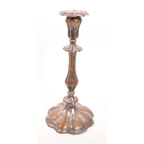 297 - A collection of 19th and 20th Century candlesticks comprising of two matching Victoran brass ' beehi... 