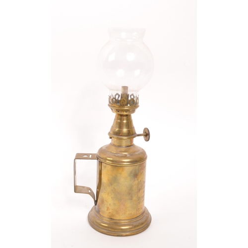 304 - A 20th Century French brass pigeon lamp / oil lamp with inscription to front: LAMPE FEUTREE 'OLYMPE'... 