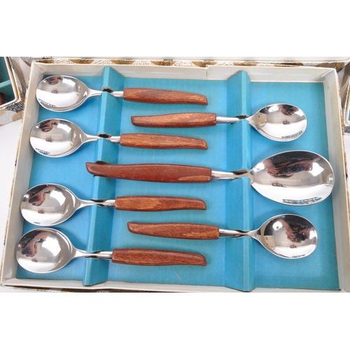 306 - Glosswood - A collection of boxed mid 20th century Glosswood stainless steel cutlery. The collection... 