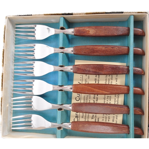 306 - Glosswood - A collection of boxed mid 20th century Glosswood stainless steel cutlery. The collection... 