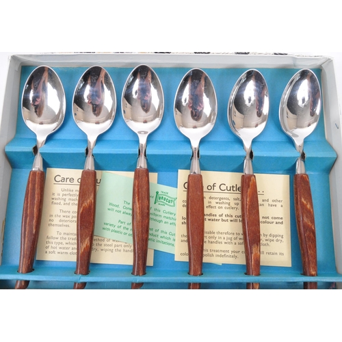 306 - Glosswood - A collection of boxed mid 20th century Glosswood stainless steel cutlery. The collection... 