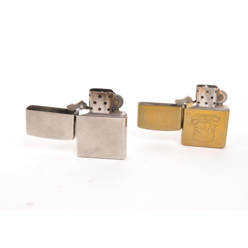 309 - A collection of five 20th century Zippo lighters. The lighters all stamped with Zippo branding to ba... 