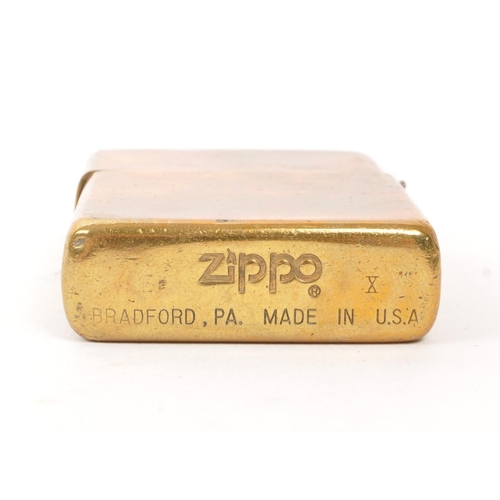 309 - A collection of five 20th century Zippo lighters. The lighters all stamped with Zippo branding to ba... 