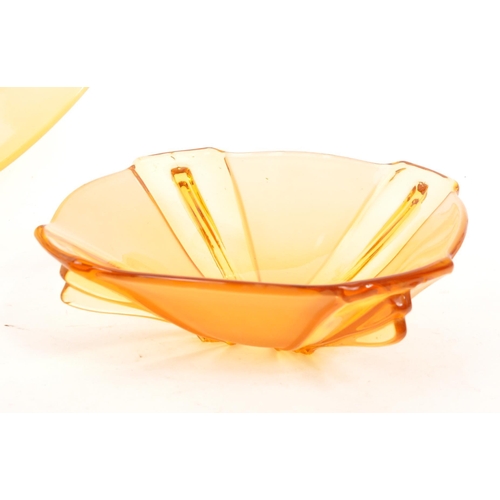 31 - A collection of 20th Century Art Deco amber glass items comprising of lidded pot / bowl, tray and ma... 