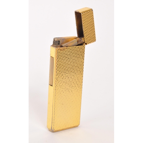 312 - Win - A mid 20th century gold tone Win Japan cigarette lighter. The lighter having gold tone engine ... 