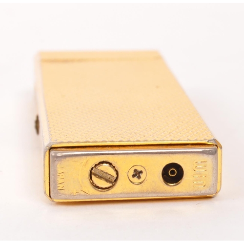 312 - Win - A mid 20th century gold tone Win Japan cigarette lighter. The lighter having gold tone engine ... 