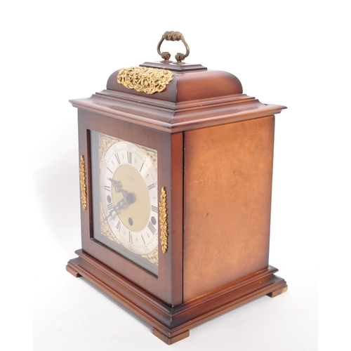 315 - St James - A vintage 20th century mantel clock. Gilt face with ebonised Roman numeral chapter ring. ... 