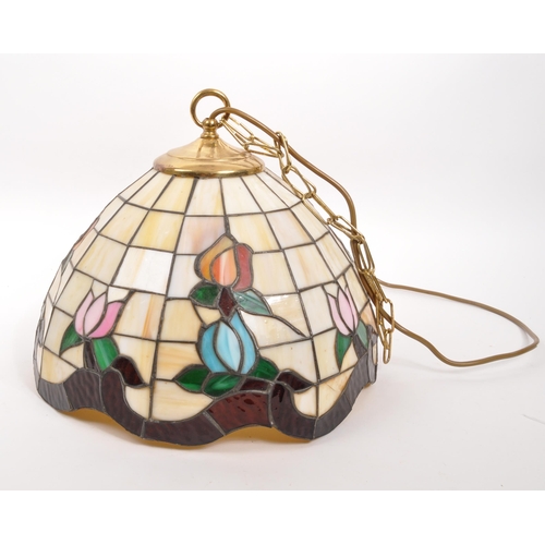 318 - Tiffany Manner - A vintage 20th century hanging ceiling light shade. Circular tapering form with col... 