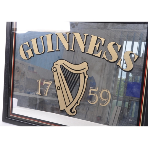 327 - Guinness - A late 20th century pub advertising point of sale sign / mirror. With the iconic harp and... 