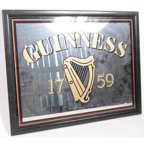 327 - Guinness - A late 20th century pub advertising point of sale sign / mirror. With the iconic harp and... 