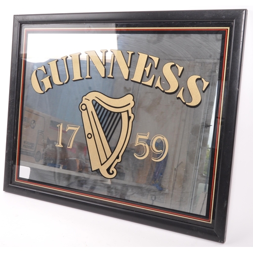 327 - Guinness - A late 20th century pub advertising point of sale sign / mirror. With the iconic harp and... 