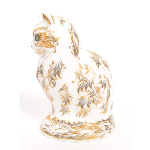 33 - Royal Crown Derby - A porcelain china Royal Crown Derby ' Fifi the Cat ' paperweight figurine. With ... 