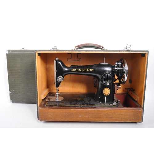 331 - Singer - A mid 20th century 1953 Singer 201k sewing machine. The sewing machine in a black colourway... 