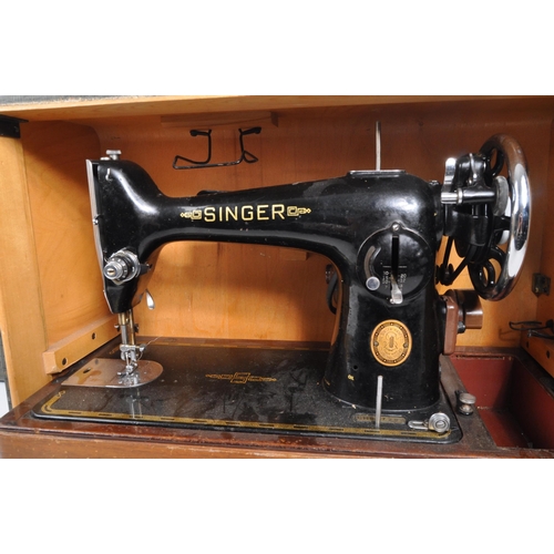 331 - Singer - A mid 20th century 1953 Singer 201k sewing machine. The sewing machine in a black colourway... 