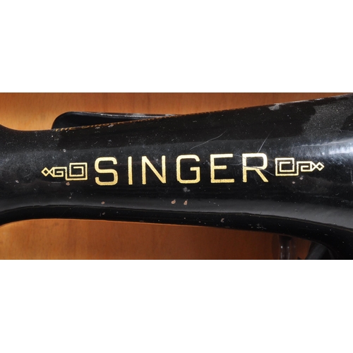 331 - Singer - A mid 20th century 1953 Singer 201k sewing machine. The sewing machine in a black colourway... 