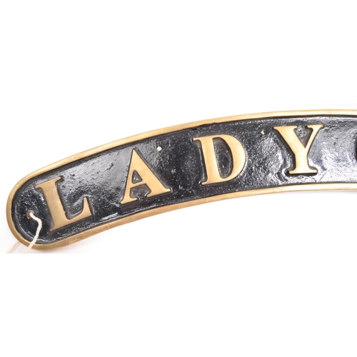 335 - A replica locomotive nameplate. Lady of Lynn. Ebonised background with gilt lettering and border. Ca... 