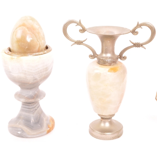 336 - A collection of vintage 20th century onyx items. To include, tabletop lighters, eggs, vases, cups, m... 