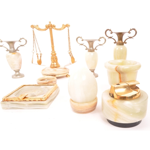 336 - A collection of vintage 20th century onyx items. To include, tabletop lighters, eggs, vases, cups, m... 