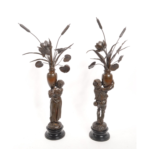 338 - A pair of early 20th century French Jardinere country metal sculptures / converted lamps. Each being... 