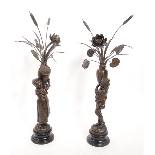 338 - A pair of early 20th century French Jardinere country metal sculptures / converted lamps. Each being... 