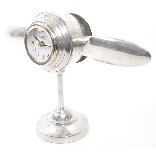 346 - A vintage 20th Century chrome desktop mantel clock in the form of aircraft engine propellers. Makers... 