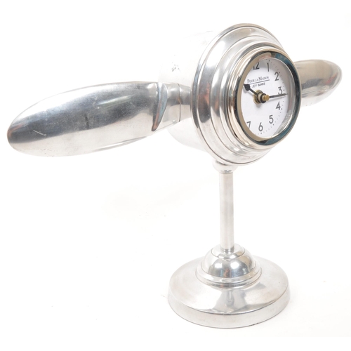 346 - A vintage 20th Century chrome desktop mantel clock in the form of aircraft engine propellers. Makers... 