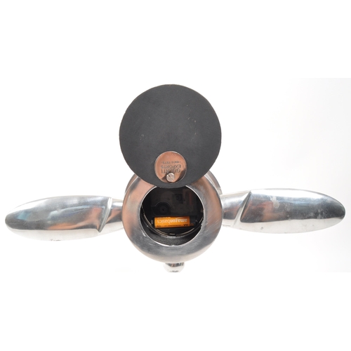 346 - A vintage 20th Century chrome desktop mantel clock in the form of aircraft engine propellers. Makers... 