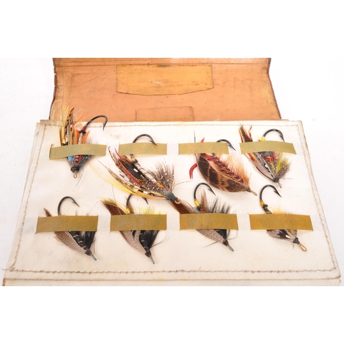 348 - A vintage Hardy Brother leather fly fishing wallet containing multicolour feather flies / lures. The... 