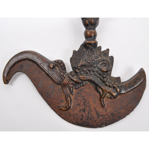 355 - A 19th century Tibetan bronze Kartika Vajra chopper having cast metal ornate details to handle. Meas... 