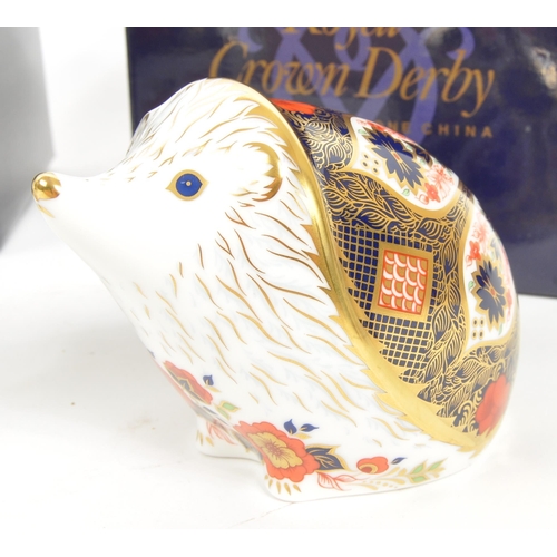 36 - Royal Crown Derby - A collection of three porcelain china Royal Crown Derby paperweights figures. Co... 