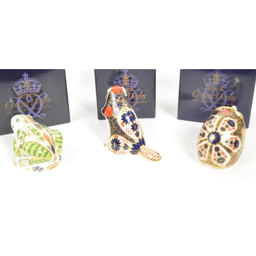 36 - Royal Crown Derby - A collection of three porcelain china Royal Crown Derby paperweights figures. Co... 