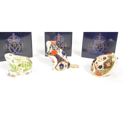 36 - Royal Crown Derby - A collection of three porcelain china Royal Crown Derby paperweights figures. Co... 