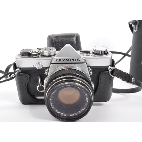 365 - Olympus - A mid 20th century circa 1970s Olympus OM-1 35mm SLR camera. The camera having silver body... 