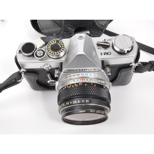 365 - Olympus - A mid 20th century circa 1970s Olympus OM-1 35mm SLR camera. The camera having silver body... 