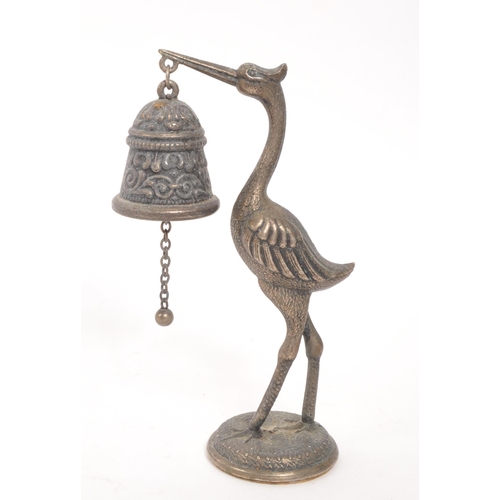 372 - A small vintage table bell of metal construction moulded into the shape of a long legged Heron bird ... 