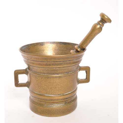 373 - A 19th Century George IV brass pestle & mortar set. The mortar in the form of a bucket with x2 s... 