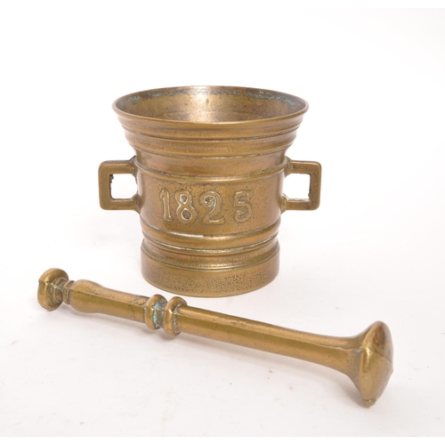 373 - A 19th Century George IV brass pestle & mortar set. The mortar in the form of a bucket with x2 s... 