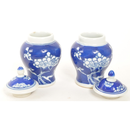 374 - Two small 20th Century Chinese blue and white ceramic ginger jars with prunus blossom decoration and... 