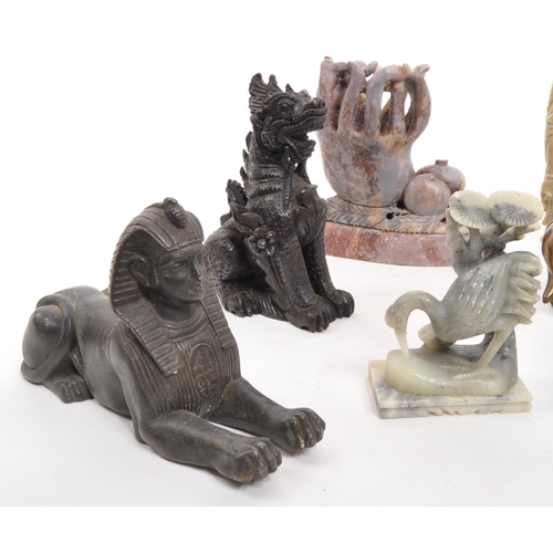 376 - A collection of assorted Asian curios to include; carved wooden dragons, soapstone Buddha, hollow ca... 