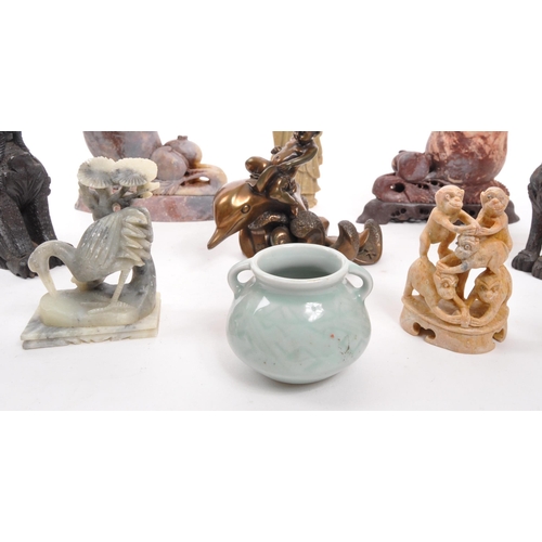 376 - A collection of assorted Asian curios to include; carved wooden dragons, soapstone Buddha, hollow ca... 