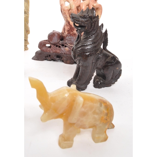 376 - A collection of assorted Asian curios to include; carved wooden dragons, soapstone Buddha, hollow ca... 