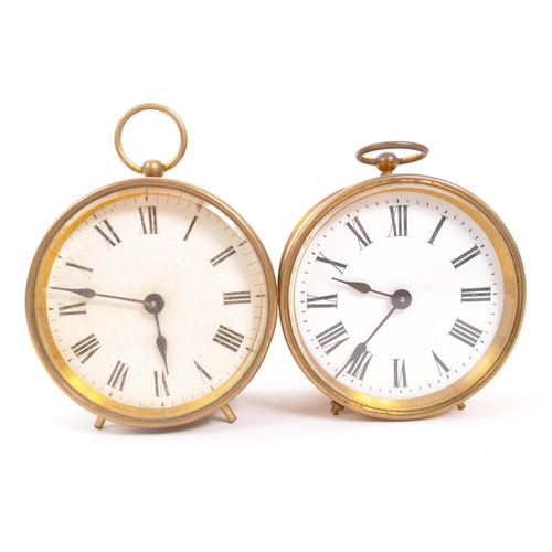 378 - Two early 20th Century brass campaign / travel drum alarm clocks. White clock faces with Roman numer... 