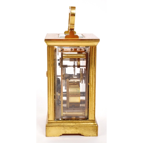 380 - An original Mappin & Webb brass cased carriage mantel clock set within bevelled glass panel side... 