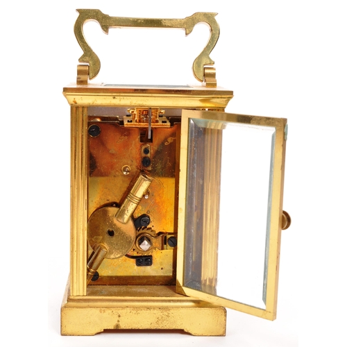 380 - An original Mappin & Webb brass cased carriage mantel clock set within bevelled glass panel side... 