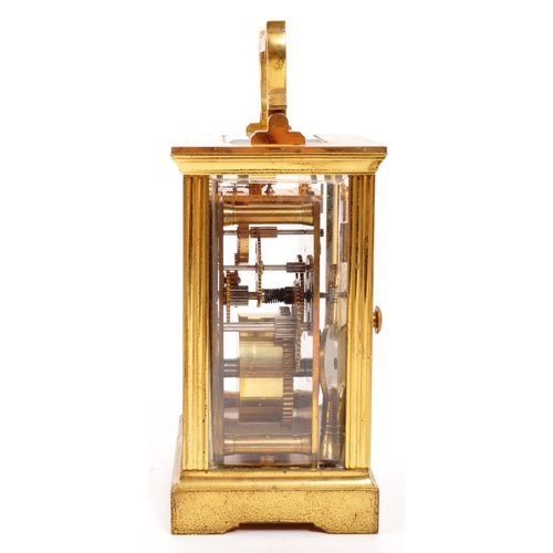 380 - An original Mappin & Webb brass cased carriage mantel clock set within bevelled glass panel side... 