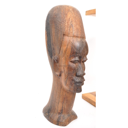 385 - A collection of African decorative wares. The collection to include carved sandalwood Mozambique fig... 